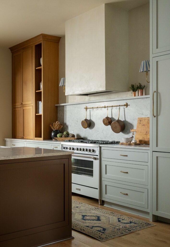 White Verona Ultima range with marble countertops and copper cookware